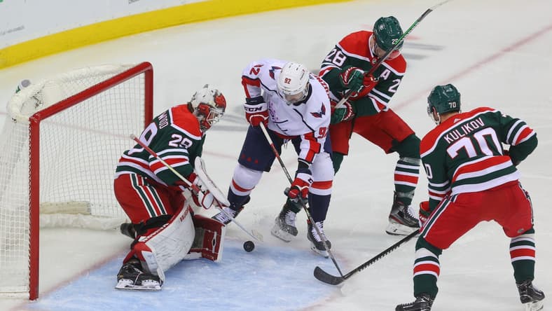 Apr 2, 2021; Newark, New Jersey, USA; New Jersey Devils goaltender Mackenzie Blackwood (29) makes a save on Washington Capitals center Evgeny Kuznetsov (92) during the second period at Prudential Center. Mandatory Credit: Ed Mulholland-USA TODAY Sports