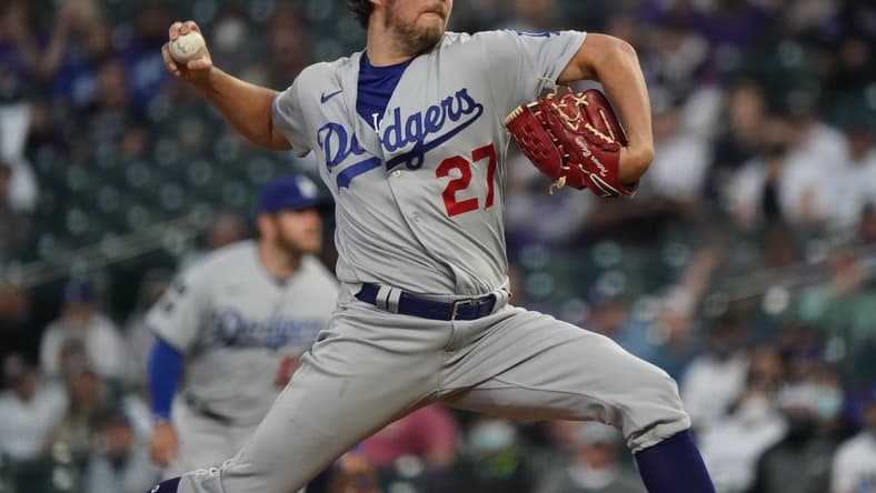 Apr 2, 2021; Denver, Colorado, USA; Los Angeles Dodgers starting pitcher Trevor Bauer (27) delivers a pitch in the second inning against the Colorado Rockies at Coors Field. Mandatory Credit: Ron Chenoy-USA TODAY Sports
