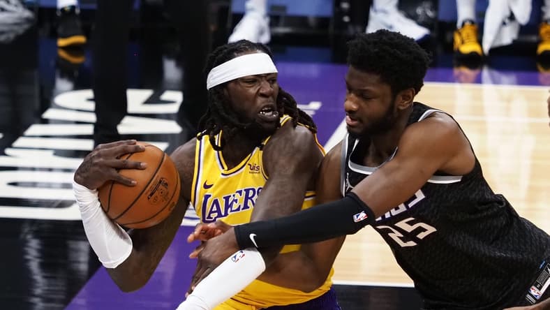 Apr 2, 2021; Sacramento, California, USA; Los Angeles Lakers forward-center Montrezl Harrell (15) controls a rebound against Sacramento Kings forward-center Chimezie Metu (25) during the first quarter at Golden 1 Center. Mandatory Credit: Kelley L Cox-USA TODAY Sports