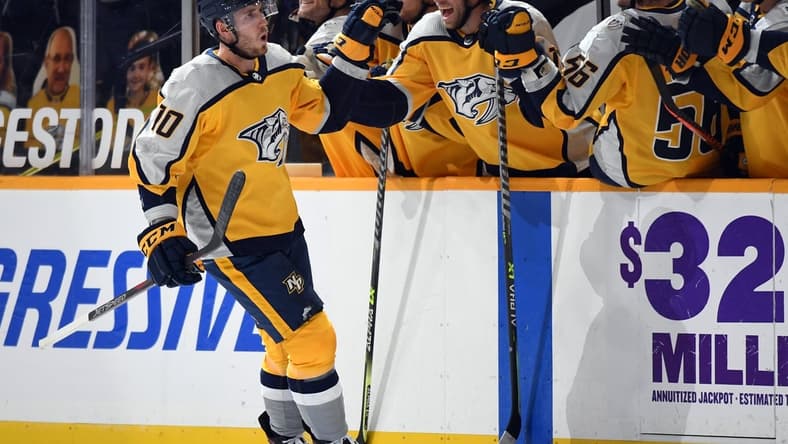 Apr 3, 2021; Nashville, Tennessee, USA; Nashville Predators center Colton Sissons (10) celebrates with teammates after scoring on a penalty shot during the second period against the Chicago Blackhawks at Bridgestone Arena. Mandatory Credit: Christopher Hanewinckel-USA TODAY Sports