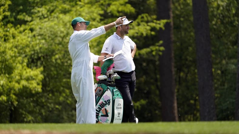 Apr 7, 2021; Augusta, GA, USA; Jon Rahm with caddie Adam Hayes on the 11th hole during a practice round for The Masters golf tournament at Augusta National Golf Club. Mandatory Credit: Rob Schumacher-USA TODAY Sports