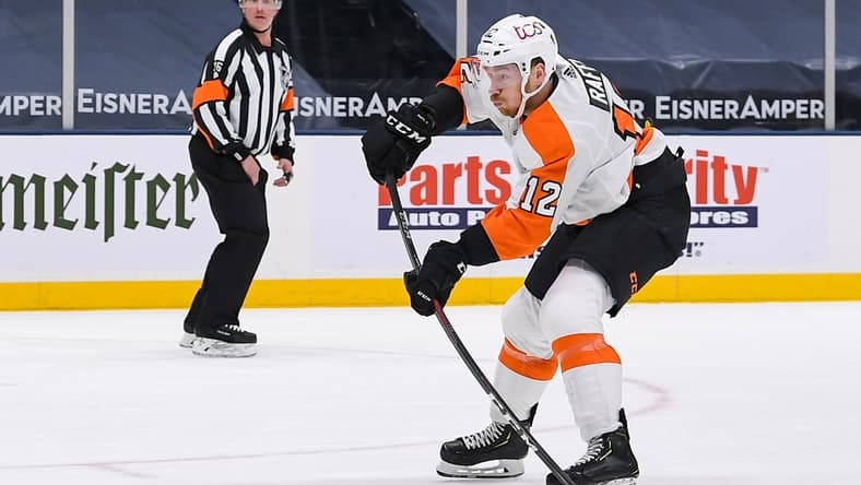 Apr 8, 2021; Uniondale, New York, USA; Philadelphia Flyers left wing Michael Raffl (12) shoots against the New York Islanders during the first period at Nassau Veterans Memorial Coliseum. Mandatory Credit: Dennis Schneidler-USA TODAY Sports