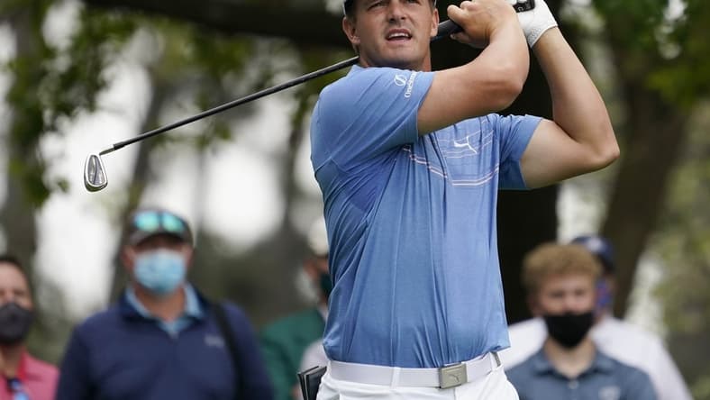 Apr 9, 2021; Augusta, Georgia, USA; Bryson DeChambeau hits his tee shot on the 4th hole during the second round of The Masters golf tournament. Mandatory Credit: Rob Schumacher-USA TODAY Sports