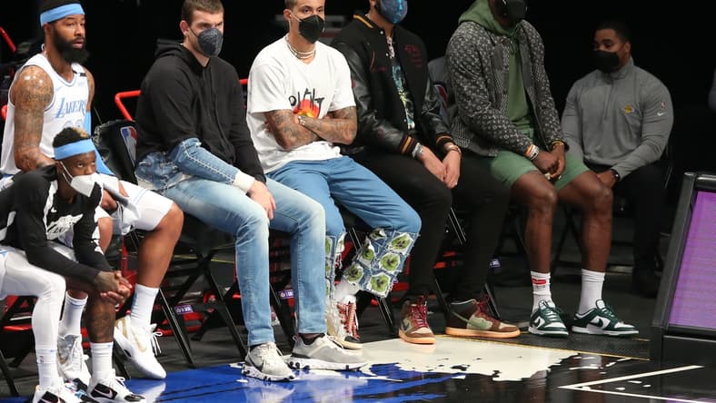 Apr 10, 2021; Brooklyn, New York, USA; Los Angeles Lakers center Marc Gasol (14) and small forward Kyle Kuzma (0) and power forward Anthony Davis (3) and small forward LeBron James (23) watch from the bench during the first quarter against the Brooklyn Nets at Barclays Center. Mandatory Credit: Brad Penner-USA TODAY Sports