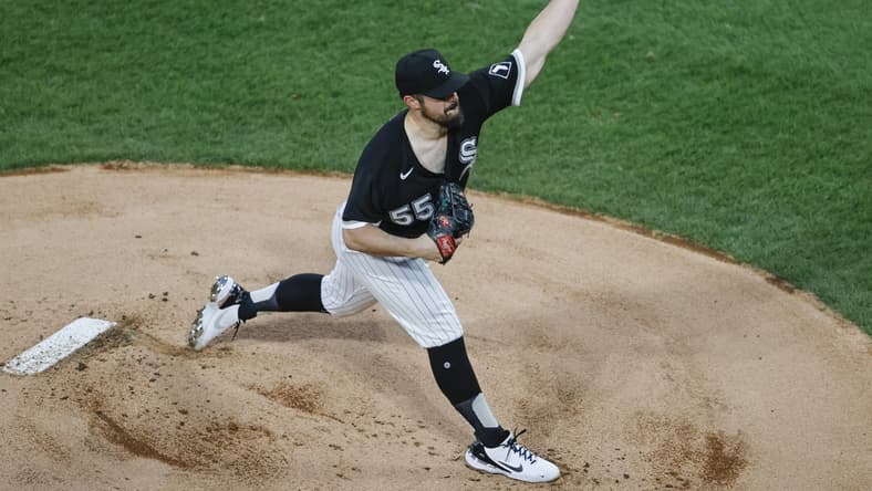 Apr 14, 2021; Chicago, Illinois, USA; Chicago White Sox starting pitcher Carlos Rodon (55) delivers against the Cleveland Indians during the first inning at Guaranteed Rate Field. Mandatory Credit: Kamil Krzaczynski-USA TODAY Sports