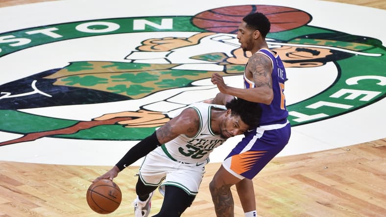 Apr 22, 2021; Boston, Massachusetts, USA; Boston Celtics guard Marcus Smart (36) controls the ball while Phoenix Suns guard Cameron Payne (15) defends during the first half at TD Garden. Mandatory Credit: Bob DeChiara-USA TODAY Sports