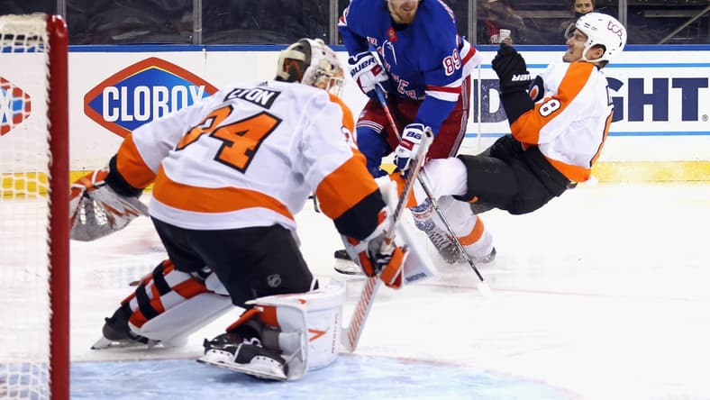 Apr 23, 2021; New York, New York, USA; Robert Hagg #8 of the Philadelphia Flyers bounces off Pavel Buchnevich #89 of the New York Rangers during the second period at Madison Square Garden. Mandatory Credit: Bruce Bennett/POOL PHOTOS-USA TODAY Sports