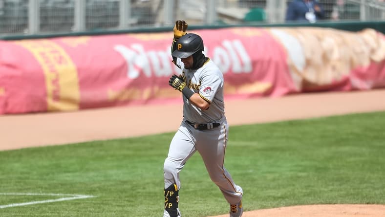 Apr 24, 2021; Minneapolis, Minnesota, USA; Pittsburgh Pirates catcher Michael Perez (5) celebrates as he rounds the bases after hitting a solo home run against the Minnesota Twins in the fifth inning at Target Field. Mandatory Credit: David Berding-USA TODAY Sports