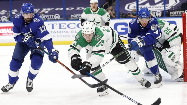 wApr 29, 2021; Tampa, Florida, USA;Tampa Bay Lightning left wing Alex Killorn (17) battles for the puck with center Alex Barre-Boulet (60) and Dallas Stars defenseman Esa Lindell (23) during the first period at Amalie Arena. Mandatory Credit: Kim Klement-USA TODAY Sports