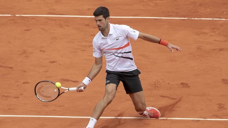 Jun 8, 2019; Paris, France; Novak Djokovic (SRB) in action during his match against Dominic Thiem (AUT) on day 14 of the 2019 French Open at Stade Roland Garros. Mandatory Credit: Susan Mullane-USA TODAY Sports