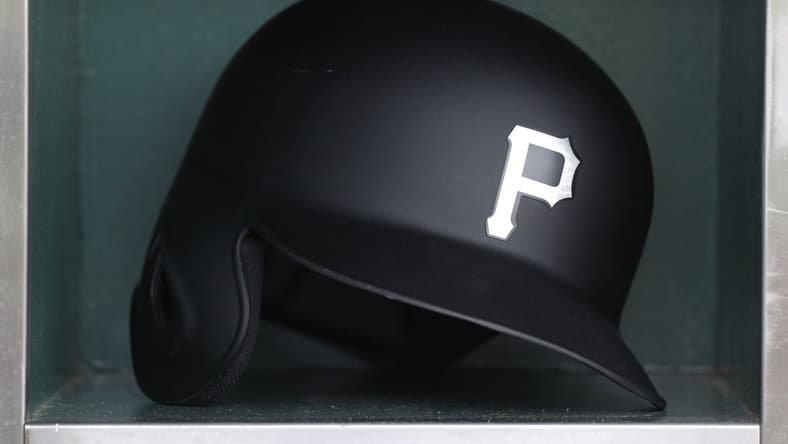 Aug 23, 2019; Pittsburgh, PA, USA; A Pittsburgh Pirates batting helmet sits in in the dugout before the game against the Cincinnati Reds during an MLB Players' Weekend game at PNC Park. Mandatory Credit: Charles LeClaire-USA TODAY Sports