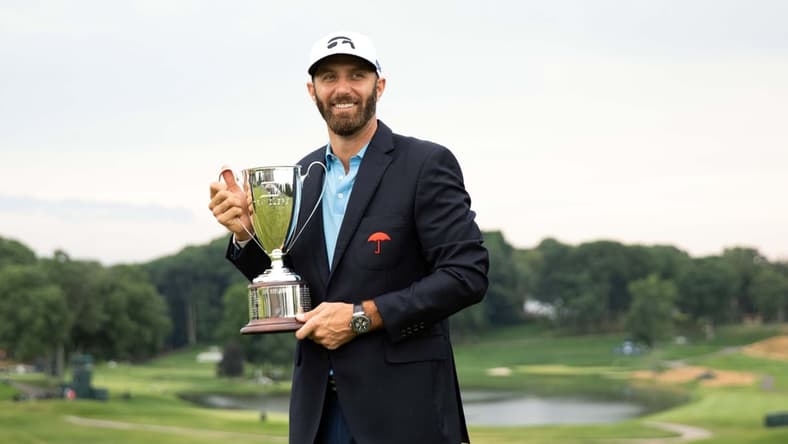 Jun 28, 2020; Cromwell, Connecticut, USA; Dustin Johnson poses with the trophy after winning the Travelers Championship golf tournament at TPC River Highlands. Mandatory Credit: Bill Streicher-USA TODAY Sports