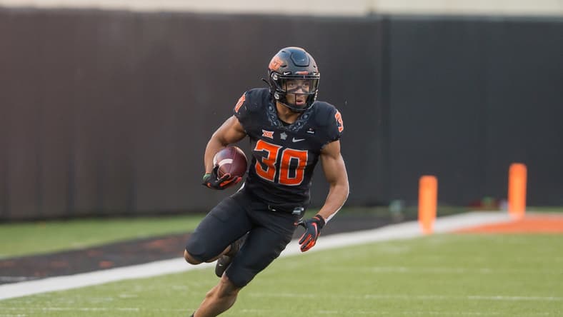 Oct 31, 2020; Stillwater, Oklahoma, USA;  Oklahoma State Cowboys running back Chuba Hubbard (30) runs the ball against the Texas Longhorns during the fourth quarter at Boone Pickens Stadium. Mandatory Credit: Brett Rojo-USA TODAY Sports