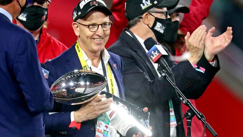 Feb 7, 2021; Tampa, FL, USA; Tampa Bay Buccaneers owner Joel Glazer celebrates with the Vince Lombardi Trophy after the Tampa Bay Buccaneers beat the Kansas City Chiefs in Super Bowl LV at Raymond James Stadium. Mandatory Credit: Mark J. Rebilas-USA TODAY Sports