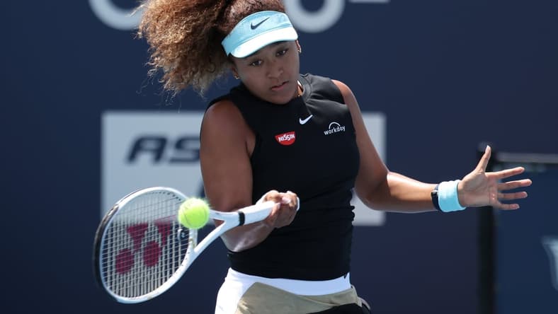 Mar 31, 2021; Miami, Florida, USA; Naomi Osaka of Japan hits a forehand against Maria Sakkari of Greece (not pictured) in a women's singles quarterfinal in the Miami Open at Hard Rock Stadium. Mandatory Credit: Geoff Burke-USA TODAY Sports