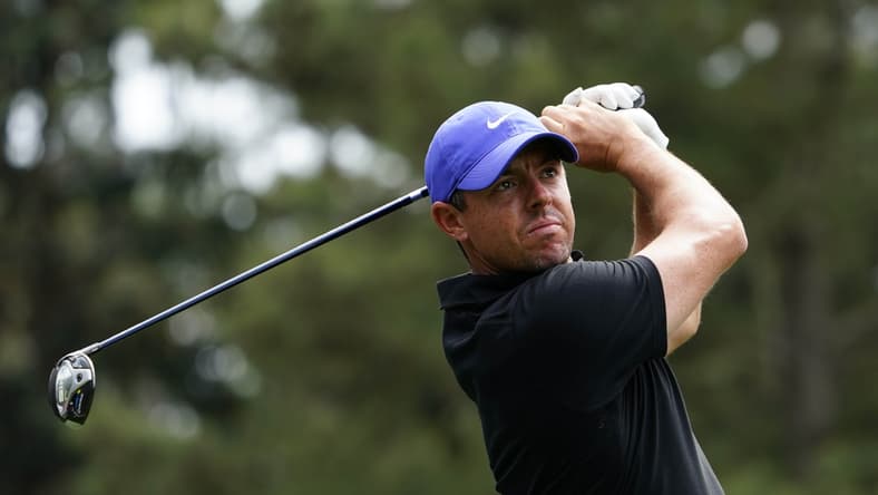 Apr 8, 2021; Augusta, Georgia, USA; Rory McIlroy hits his tee shot on the 18th hole during the first round of The Masters golf tournament. Mandatory Credit: Michael Madrid-USA TODAY Sports