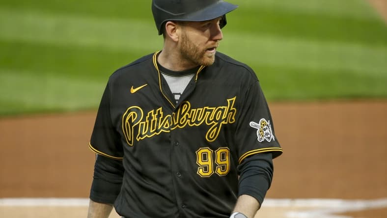 Apr 23, 2021; Minneapolis, Minnesota, USA; Pittsburgh Pirates first baseman Todd Frazier (99) returns to the dugout after striking out to the Minnesota Twins in the second inning at Target Field. Mandatory Credit: Bruce Kluckhohn-USA TODAY Sports