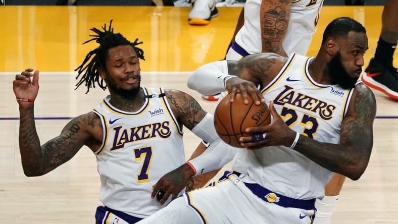 May 2, 2021; Los Angeles, California, USA; Los Angeles Lakers forward LeBron James (23) gets a rebound in front of guard Ben McLemore (7) against the Toronto Raptors during the second half at Staples Center. Mandatory Credit: Gary A. Vasquez-USA TODAY Sports