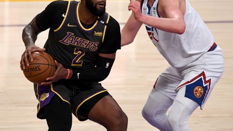 May 3, 2021; Los Angeles, California, USA; Los Angeles Lakers center Andre Drummond (2) is defended by Denver Nuggets center Nikola Jokic (15) in the first quarter of the game at Staples Center. Mandatory Credit: Jayne Kamin-Oncea-USA TODAY Sports