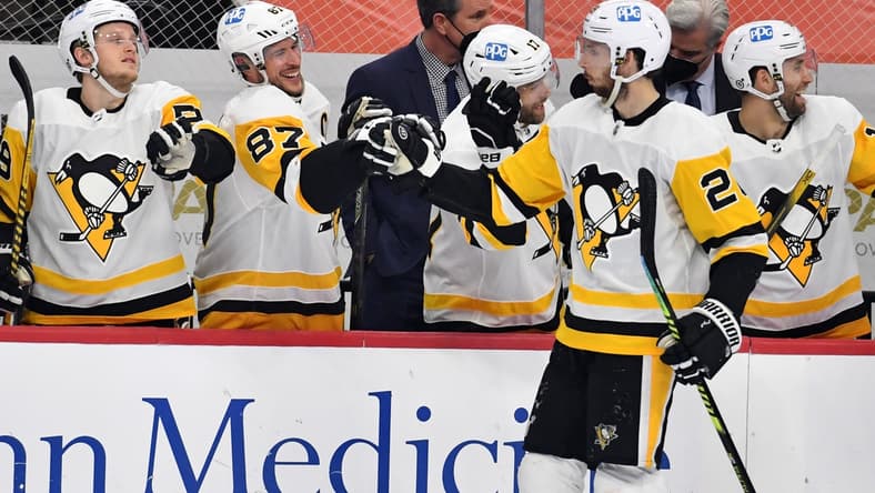 May 4, 2021; Philadelphia, Pennsylvania, USA; Pittsburgh Penguins defenseman Marcus Pettersson (28) celebrates his goal with center Sidney Crosby (87) and left wing Jake Guentzel (59) against the Philadelphia Flyers during the first period at Wells Fargo Center. Mandatory Credit: Eric Hartline-USA TODAY Sports