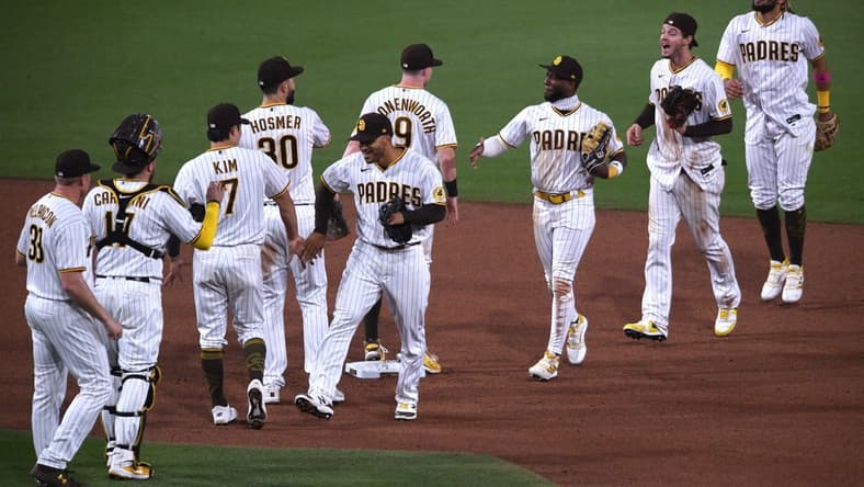 May 5, 2021; San Diego, California, USA; San Diego Padres players celebrate on the field after defeating the Pittsburgh Pirates at Petco Park. Mandatory Credit: Orlando Ramirez-USA TODAY Sports