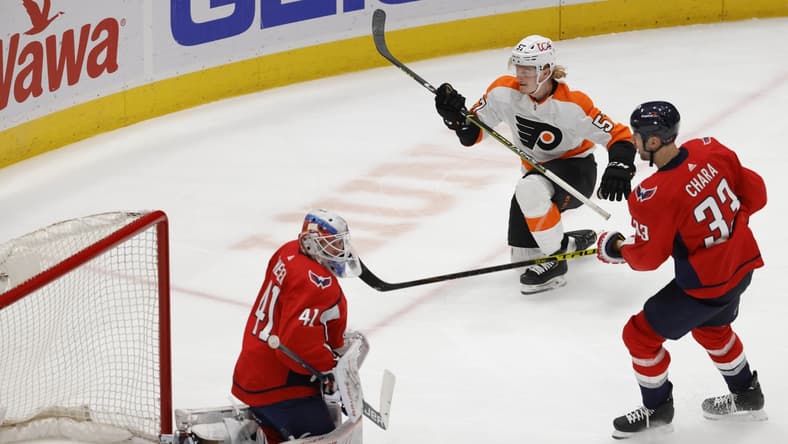 May 7, 2021; Washington, District of Columbia, USA; Philadelphia Flyers right wing Wade Allison (57) scores a goal on Washington Capitals goaltender Vitek Vanecek (41) in the second period at Capital One Arena. Mandatory Credit: Geoff Burke-USA TODAY Sports