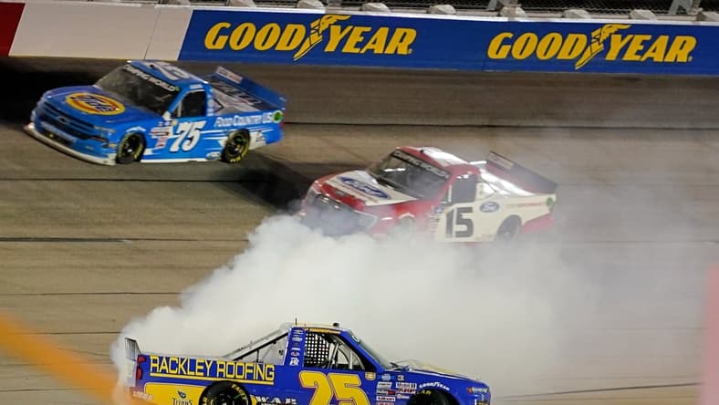 May 7, 2021; Darlington, Darlington, USA; NASCAR Truck Series driver Timothy Peters (25) spins during the LiftKits4Less.com 200 at Darlington Raceway. Mandatory Credit: Jasen Vinlove-USA TODAY Sports