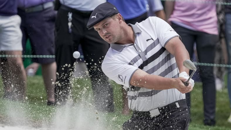 May 8, 2021; Charlotte, North Carolina, USA; Bryson DeChambeau pitches out of the bunker on 18 during the third round of the Wells Fargo Championship golf tournament. Mandatory Credit: Jim Dedmon-USA TODAY Sports