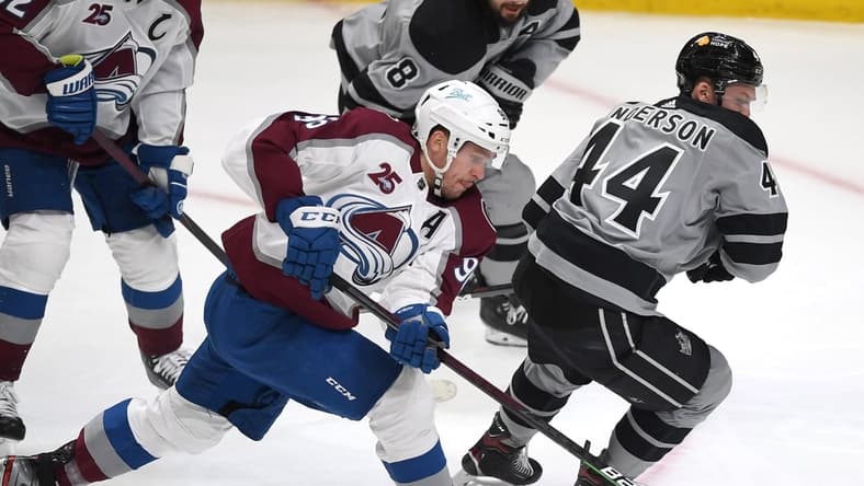 May 8, 2021; Los Angeles, California, USA; Colorado Avalanche right wing Mikko Rantanen (96) and Los Angeles Kings defenseman Mikey Anderson (44) battle for the puck in the first period of the game at Staples Center. Mandatory Credit: Jayne Kamin-Oncea-USA TODAY Sports