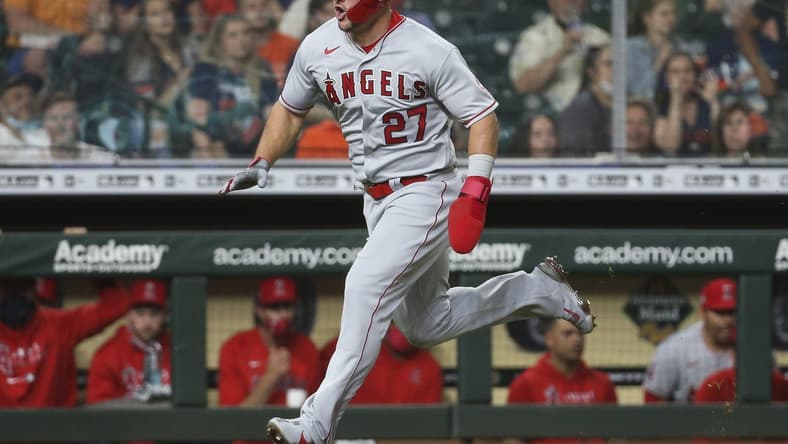 May 10, 2021; Houston, Texas, USA; Los Angeles Angels center fielder Mike Trout (27) runs towards home plate to score a run during the fourth inning against the Houston Astros at Minute Maid Park. Mandatory Credit: Troy Taormina-USA TODAY Sports