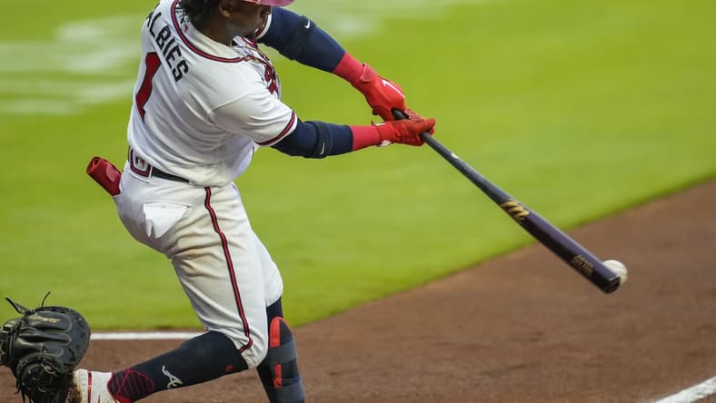 May 11, 2021; Cumberland, Georgia, USA; Atlanta Braves second baseman Ozzie Albies (1) hits an RBI single against the Toronto Blue Jays during the first inning at Truist Park. Mandatory Credit: Dale Zanine-USA TODAY Sports