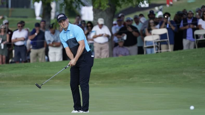 May 13, 2021; McKinney, Texas, USA; Jordan Spieth watches his putt on the eighteenth green for an eagle during the first round of the AT&T Byron Nelson golf tournament. Mandatory Credit: Jim Cowsert-USA TODAY Sports