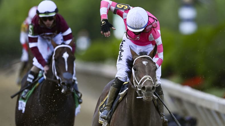 May 15, 2021; Baltimore, Maryland, USA; Flavien Prat aboard Rombauer reacts after winning the 146th running of the Preakness Stakes at Pimlico Race Course. Mandatory Credit: Tommy Gilligan-USA TODAY Sports
