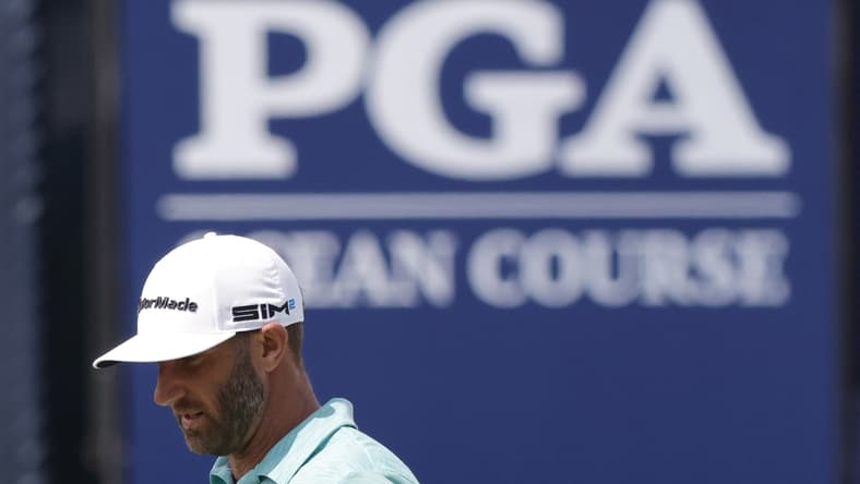 May 18, 2021; Kiawah Island, South Carolina, USA; Dustin Johnson stands on the ninth green during a practice round for the PGA Championship golf tournament at Ocean Course at Kiawah Island Resort. Mandatory Credit: Geoff Burke-USA TODAY Sports