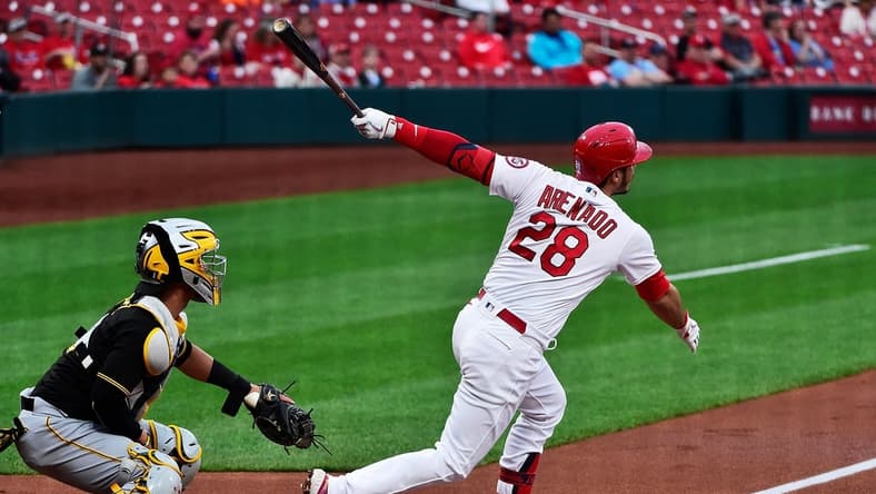 May 18, 2021; St. Louis, Missouri, USA; St. Louis Cardinals third baseman Nolan Arenado (28) hits a two run home run during the first inning against the Pittsburgh Pirates at Busch Stadium. Mandatory Credit: Jeff Curry-USA TODAY Sports