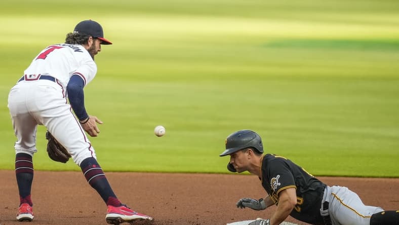 May 20, 2021; Cumberland, Georgia, USA; Pittsburgh Pirates second baseman Adam Frazier (26) slides into second base after hitting a double against the Atlanta Braves during the first inning at Truist Park. Mandatory Credit: Dale Zanine-USA TODAY Sports