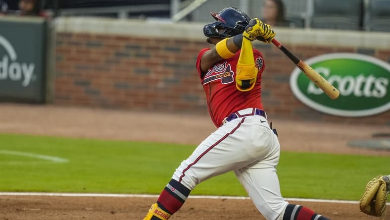 May 21, 2021; Cumberland, Georgia, USA; Atlanta Braves right fielder Ronald Acuna Jr. (13) hits a grand slam home run against the Pittsburgh Pirates during the second inning at Truist Park. Mandatory Credit: Dale Zanine-USA TODAY Sports