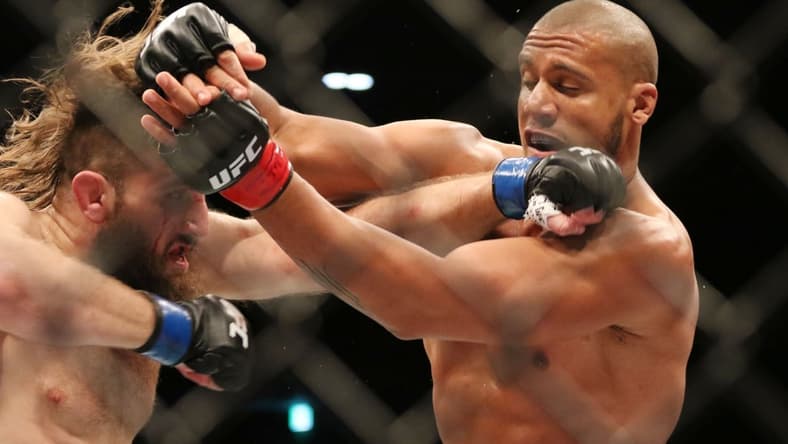 Dec 21, 2019; Busan, SOUTH KOREA; Ciryl Gane (red gloves) fights Tanner Boser (blue gloves) during UFC Fight Night at Sajik Arena. Mandatory Credit: Jasmin Frank-USA TODAY Sports