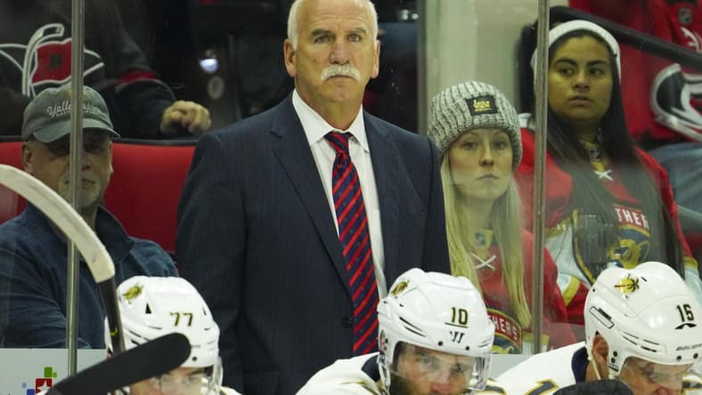 Dec 21, 2019; Raleigh, North Carolina, USA; Florida Panthers head coach Joel Quenneville looks on from behind the players bench against the Carolina Hurricanes at PNC Arena. The Florida Panthers defeated the Carolina Hurricanes 4-2. Mandatory Credit: James Guillory-USA TODAY Sports
