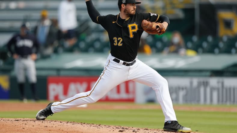 5Mar 6, 2021; Bradenton, Florida, USA;  Pittsburgh Pirates relief pitcher Geoff Hartlieb (32) pitches the fourth inning during spring training at LECOM Park. Mandatory Credit: Nathan Ray Seebeck-USA TODAY Sports
