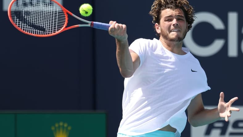 Mar 26, 2021; Miami, Florida, USA; Taylor Fritz of the United States hits a forehand against Marcos Giron of the United States (not pictured) in the second round in the Maimi Open at Hard Rock Stadium. Mandatory Credit: Geoff Burke-USA TODAY Sports