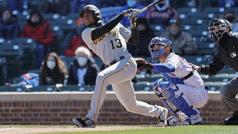 Apr 1, 2021; Chicago, Illinois, USA; Pittsburgh Pirates third baseman Ke'Bryan Hayes (13) hits a two-run home run against the Chicago Cubs in the first inning at Wrigley Field. Mandatory Credit: Kamil Krzaczynski-USA TODAY Sports