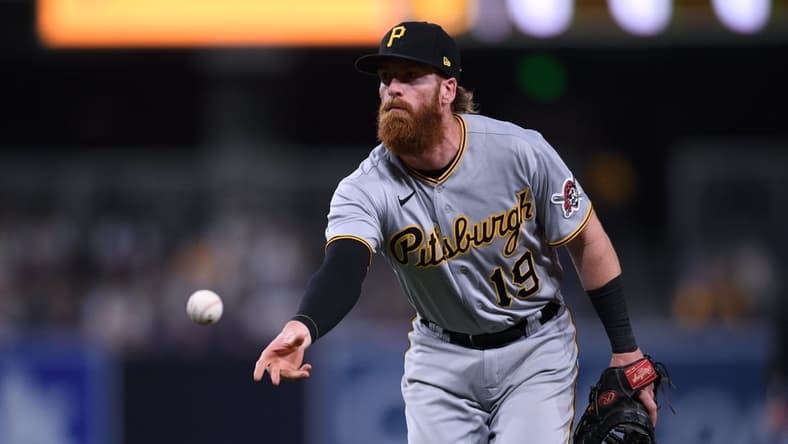 May 3, 2021; San Diego, California, USA; Pittsburgh Pirates first baseman Colin Moran (19) tosses the ball to first base during the eighth inning against the San Diego Padres at Petco Park. Mandatory Credit: Orlando Ramirez-USA TODAY Sports