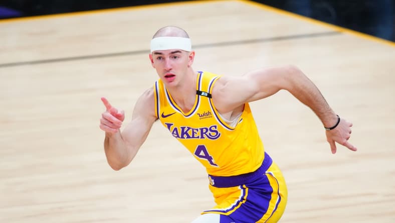 May 25, 2021; Phoenix, Arizona, USA; Los Angeles Lakers guard Alex Caruso (4) reacts against the Phoenix Suns during game two of the first round of the 2021 NBA Playoffs at Phoenix Suns Arena. Mandatory Credit: Mark J. Rebilas-USA TODAY Sports