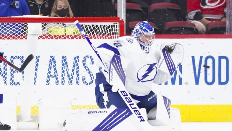 Jun 1, 2021; Raleigh, North Carolina, USA; Tampa Bay Lightning goaltender Andrei Vasilevskiy (88) gets ready to make a glove save against the Carolina Hurricanes in game two of the second round of the 2021 Stanley Cup Playoffs at PNC Arena. Mandatory Credit: James Guillory-USA TODAY Sports