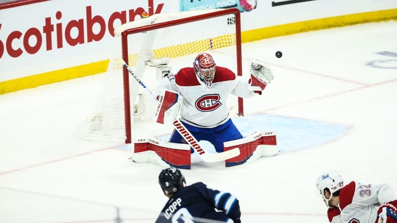 Jun 4, 2021; Winnipeg, Manitoba, CAN; Winnipeg Jets forward Andrew Copp (9) shoots wide of Montreal Canadiens goalie Carey Price (31) during the first period in game two of the second round of the 2021 Stanley Cup Playoffs at Bell MTS Place. Mandatory Credit: Terrence Lee-USA TODAY Sports