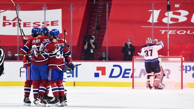 Jun 6, 2021; Montreal, Quebec, CAN; Montreal Canadiens forward Corey Perry (94) reacts with teammates after scoring a goal against Winnipeg Jets goalie Connor Hellebuyck (37) during the first period in game three of the second round of the 2021 Stanley Cup Playoffs at the Bell Centre. Mandatory Credit: Eric Bolte-USA TODAY Sports