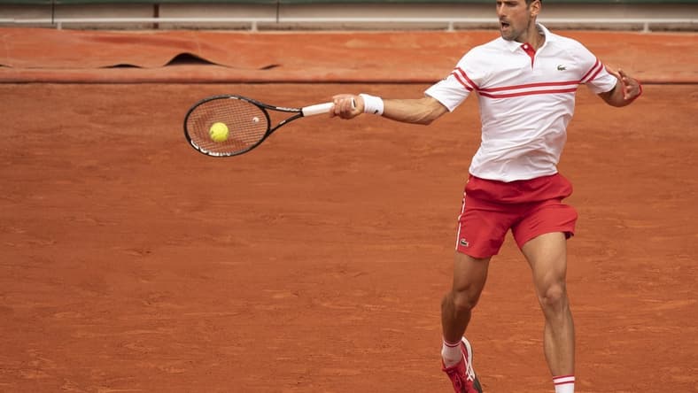 Jun 7, 2021; Paris, France; Novak Djokovic (SRB) in action during his match against Lorenzo Musetti (ITA) on day nine of the French Open at Stade Roland Garros. Mandatory Credit: Susan Mullane-USA TODAY Sports