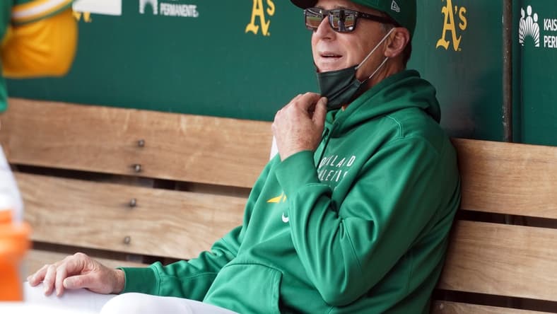 May 29, 2021; Oakland, California, USA; Oakland Athletics manager Bob Melvin (6) sits in the dugout before the game against the Los Angeles Angels at RingCentral Coliseum. Mandatory Credit: Darren Yamashita-USA TODAY Sports