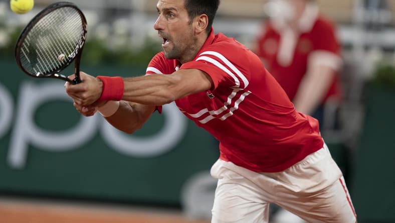 Jun 9, 2021; Paris, France; Novak Djokovic (SRB) in action during his match against Matteo Berrettini (ITA) on day 11 of the French Open at Stade Roland Garros. Mandatory Credit: Susan Mullane-USA TODAY Sports